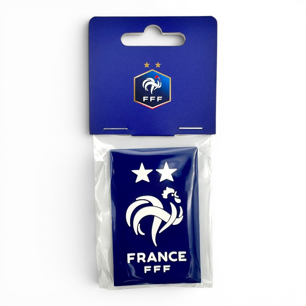 FFF Kühlschrankmagnet in Blau mit weißem Gallier-Hahn Logo und zwei Sternen in Originalverpackung.