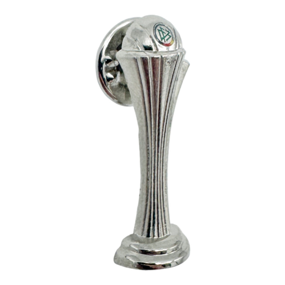 Macro shot of the Women's DFB Pokal pin badge, highlighting the elegant trophy silhouette and relief.