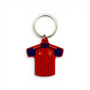 Keyring featuring the design of the Spain jersey (2026 World Cup), made from red PVC with dark blue accents.